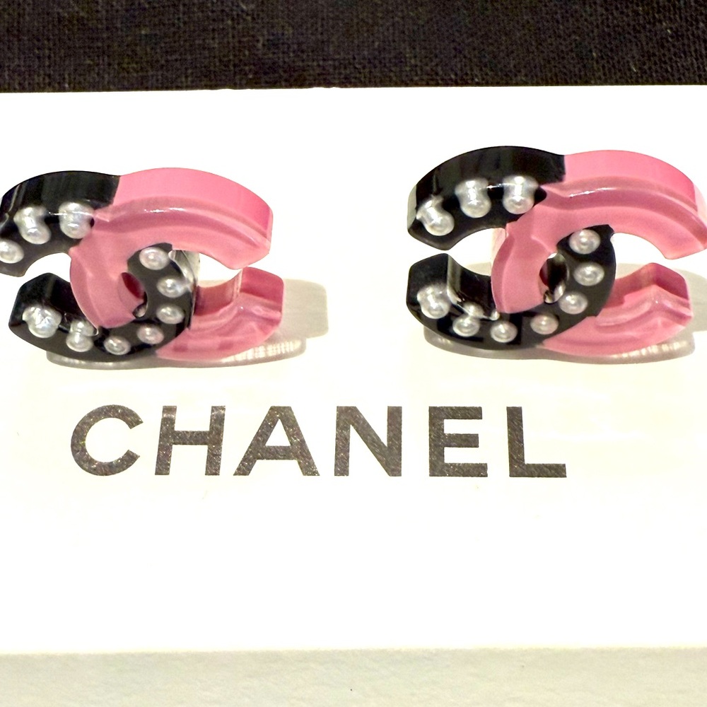 Authentic two tone color Chanel resin earrings.